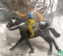 Cowboy on horseback with revolver and bag - Image 2