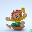 Pumuckl sitting in plate with spoon - Image 1