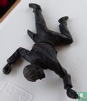 Cowboy lying with revolver (black) - Image 1