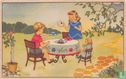 Jongen en meisje drinken thee met pop aan tafel in tuin - Bild 1