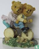 tricycle with two bears on it