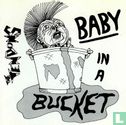 Baby in a bucket - Image 1
