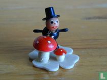 Ramoneur avec le trèfle à 4 feuilles et les champignons