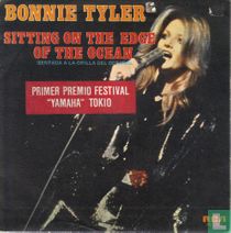 Sitting on the edge of the ocean