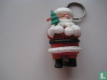 kerstman met kerstboom in hand
