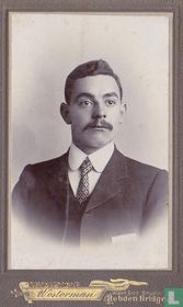 Young man with mustache and tie