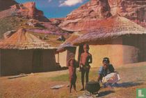 Stoking the fire in a Basuto kraal