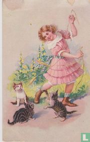 Meisje speelt met drie katten
