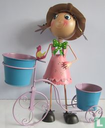 Driewieler met poppetje en bakjes