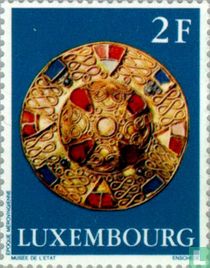 Gouden mantelspeld