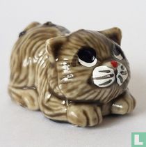 Cat lying on tummy