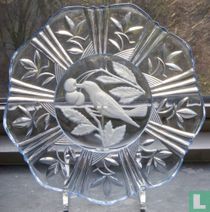 Blue pressed glass bowl with bird