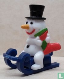 Schneemann auf Schlitten