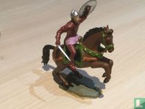 Cavalier avec bouclier en l'air et épée 