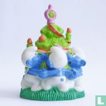 Three smurfs around Christmas tree