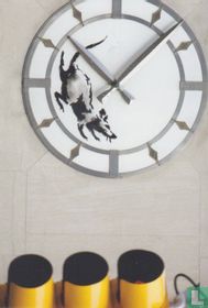 Rat running in a street clock face like a hamster wheel, corner of 14th Street and 6th Avenue in New York City
