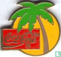 zon met palmboom coca cola