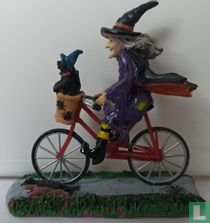 Hexe auf einem Fahrrad