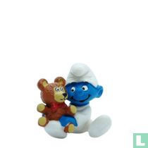 Babysmurf met teddybeer 
