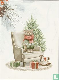 Kat in zetel naast kerstboom  