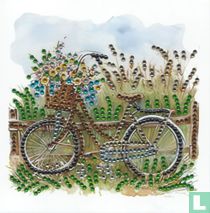 Bruine fiets bij hekje