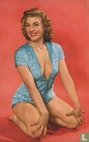 Vrouw in blauw/witee badpak zittend op knieën
