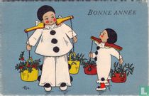 Twee pierrot dragen juk met hulst en witte bessen (BA)