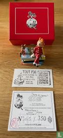 Spirou and Fantasio sitting on books