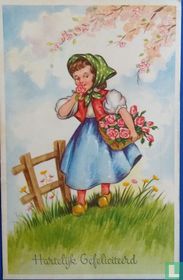 Meisje met bloemen bij hekje