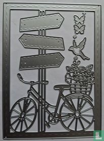 Damesfiets bij richtingpaal